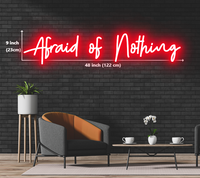 A luminous neon sign boldly stating "Afraid of Nothing" in captivating colors