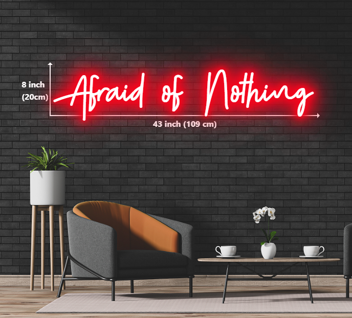 A luminous neon sign boldly stating "Afraid of Nothing" in captivating colors